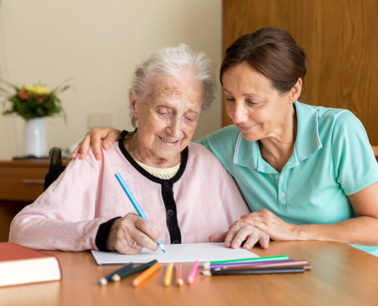 Dementia and Occupational Therapy - Home caregiver and senior adult woman
